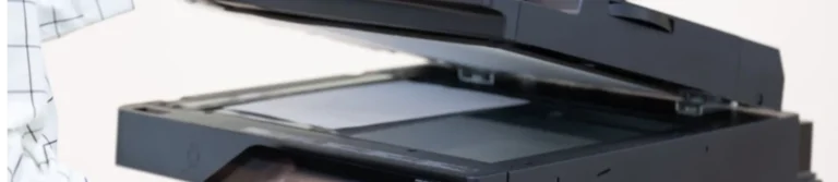 Businessman using the control panel of an office photocopier