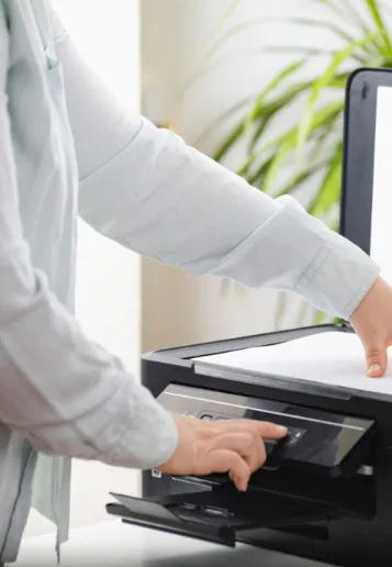Office manager making photocopies on a laser copier